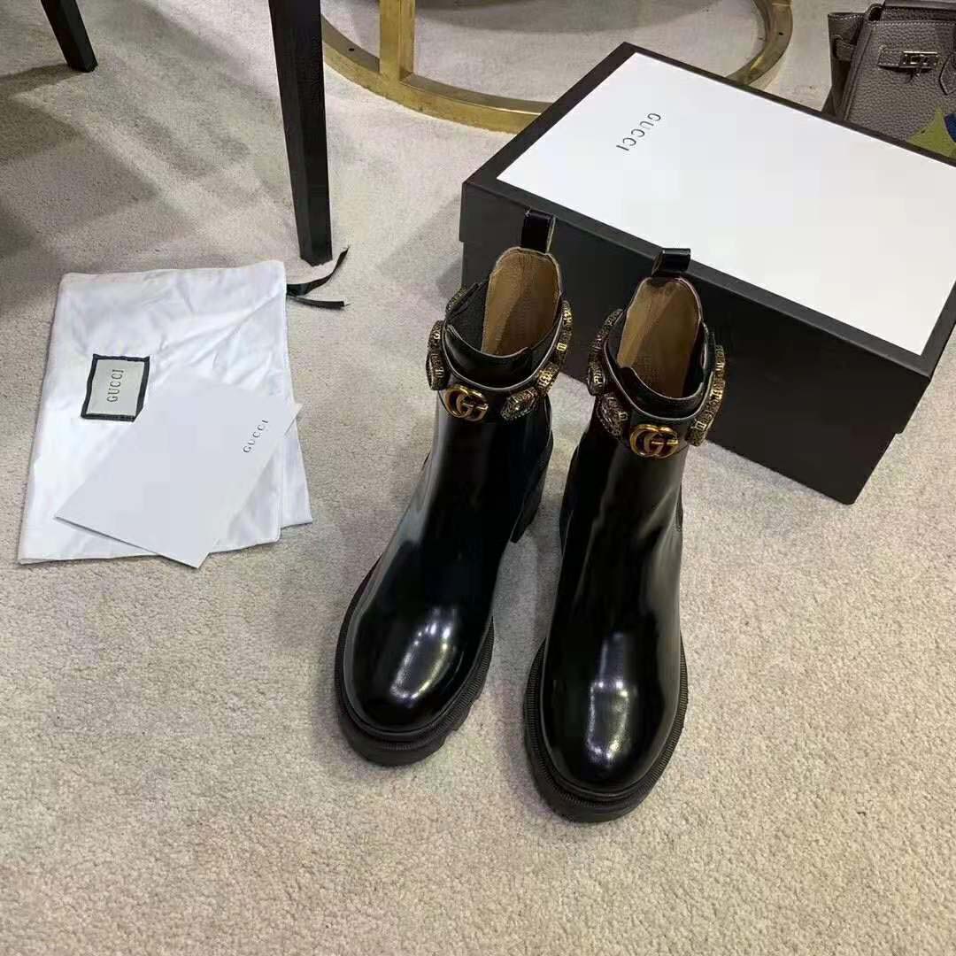 G*u*i women leather ankle boot with belt 6 cm heel in black shiny leather