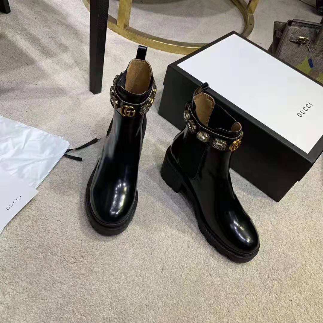 G*u*i women leather ankle boot with belt 6 cm heel in black shiny leather