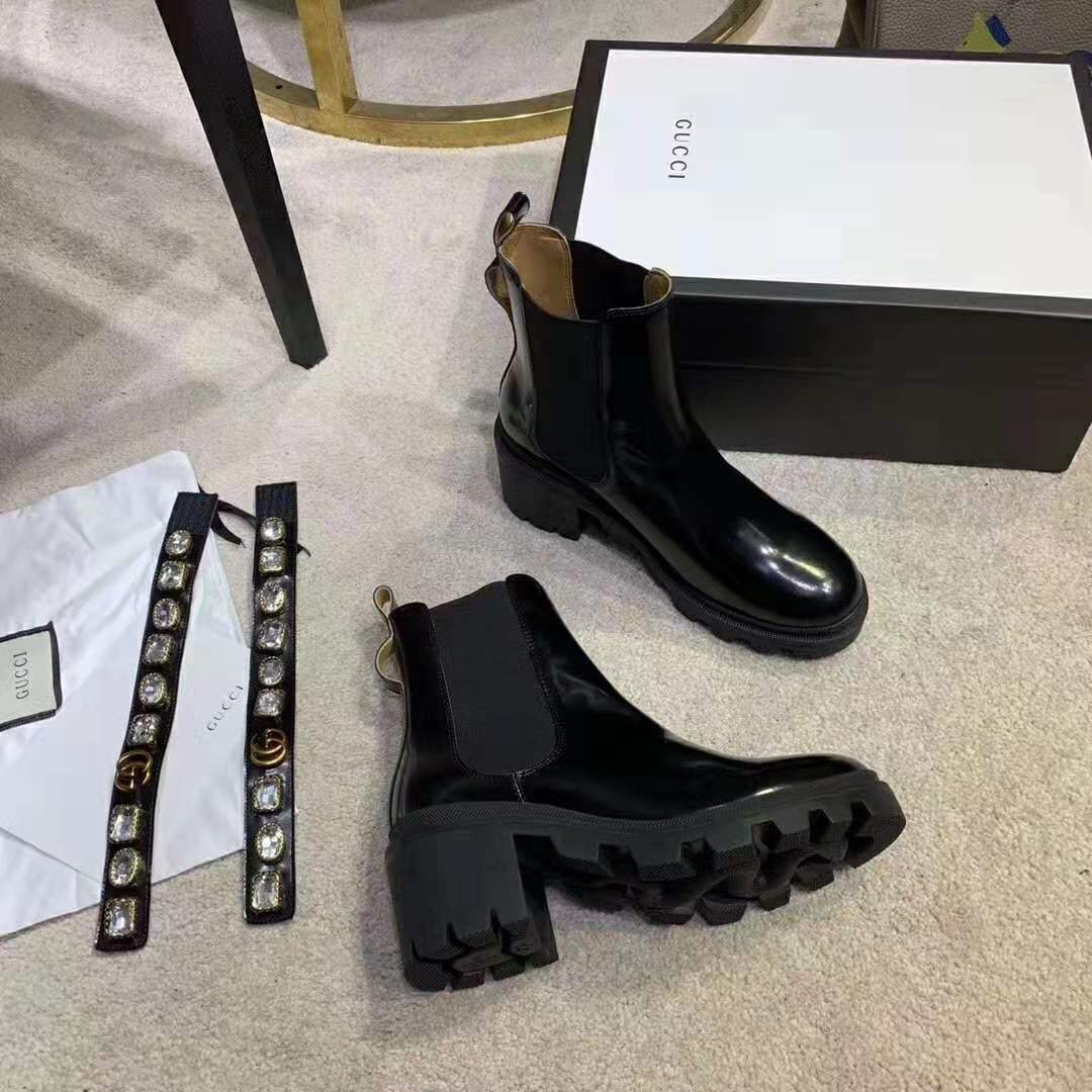 G*u*i women leather ankle boot with belt 6 cm heel in black shiny leather