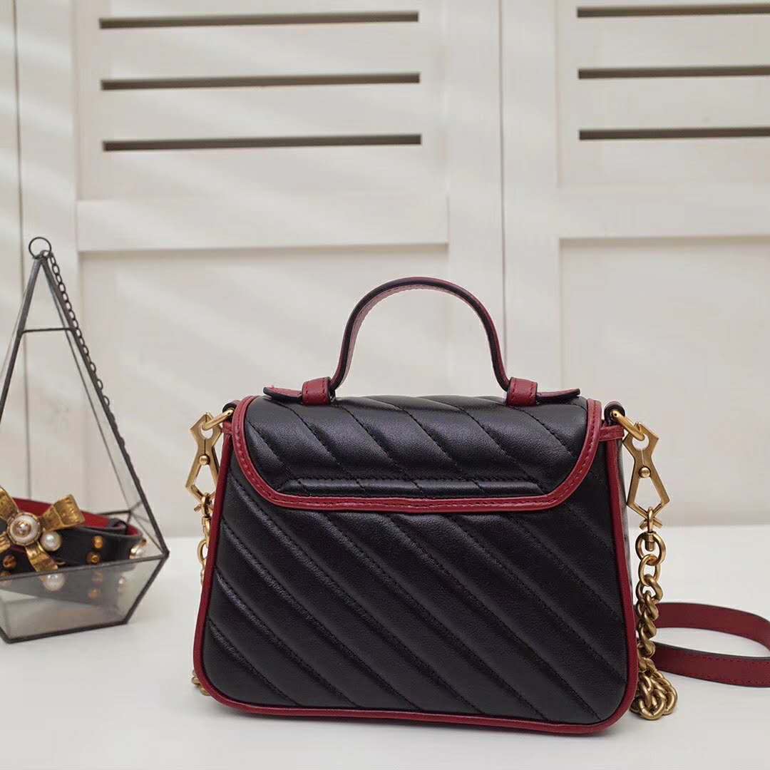 G*u*i gg women gg marmont mini top handle bag in black diagonal matelassé leather