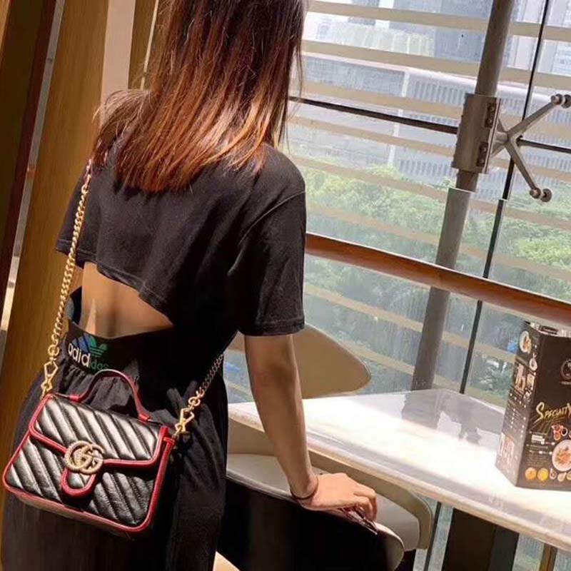 G*u*i gg women gg marmont small top handle bag in black diagonal matelassé leather