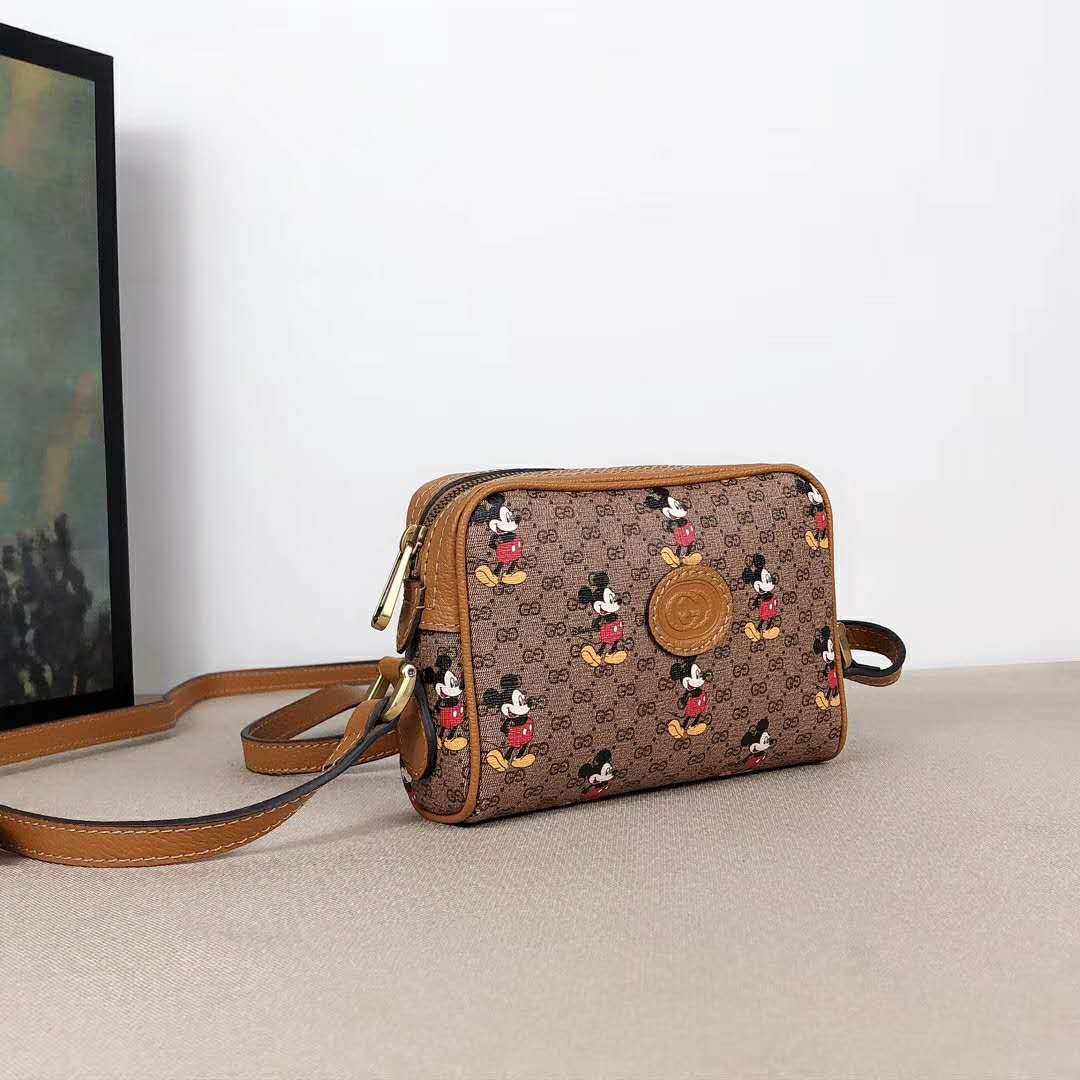 G*u*i gg women disney x G*u*i shoulder bag gg supreme canvas