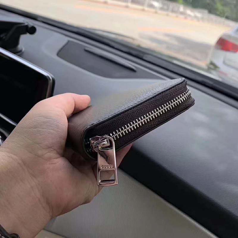 G*u*i gg unisex leather zip around wallet black metal gg