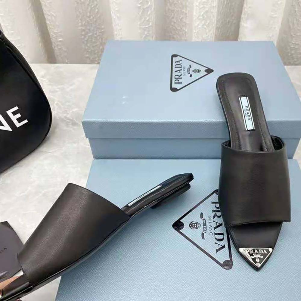 Prada Women Brushed Leather Slides with a Modernist Line Feature an Unexpected