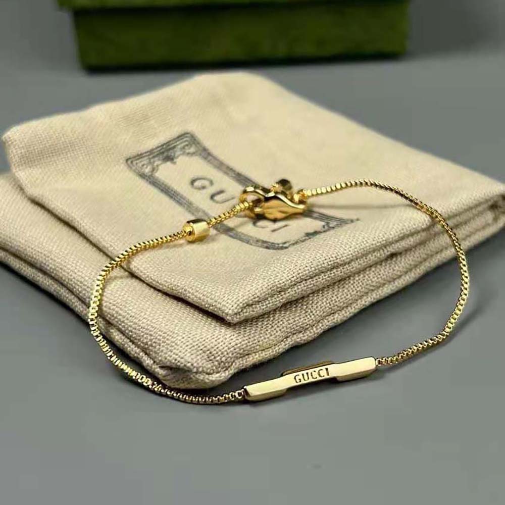 G*u*i women link to love bracelet with ‘G*u*i’ bar in yellow gold