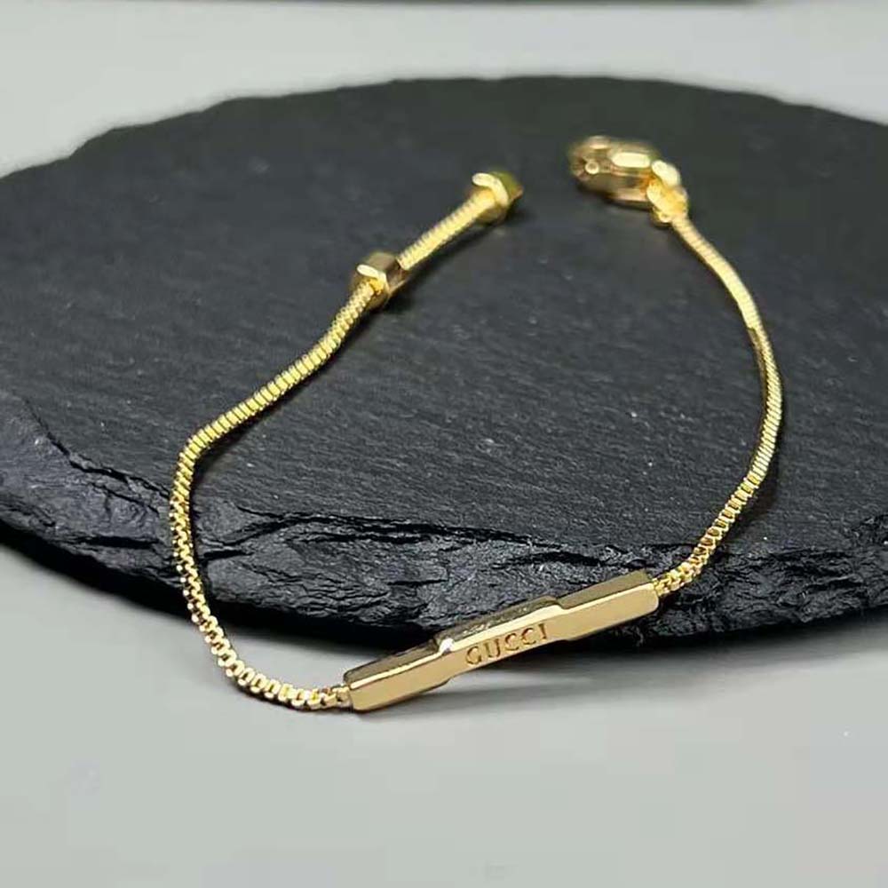 G*u*i women link to love bracelet with ‘G*u*i’ bar in yellow gold