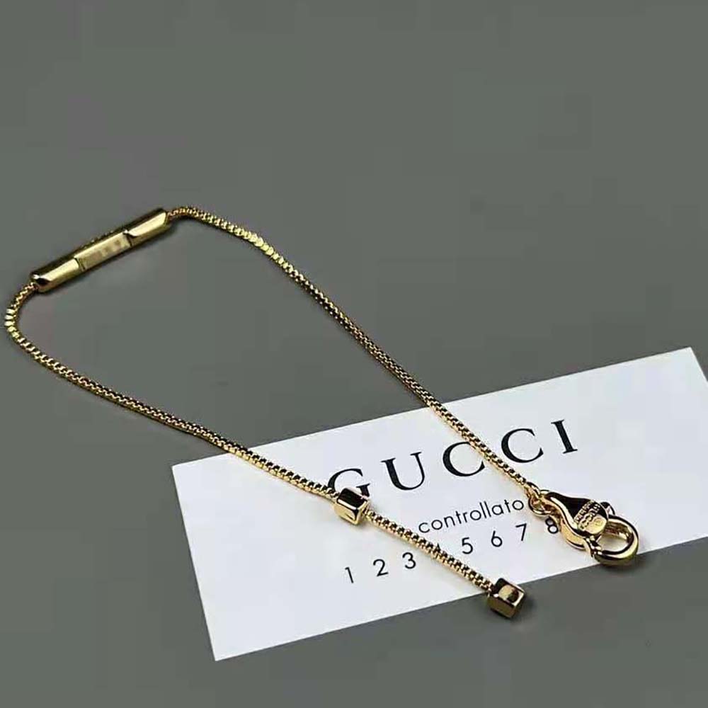 G*u*i women link to love bracelet with ‘G*u*i’ bar in yellow gold